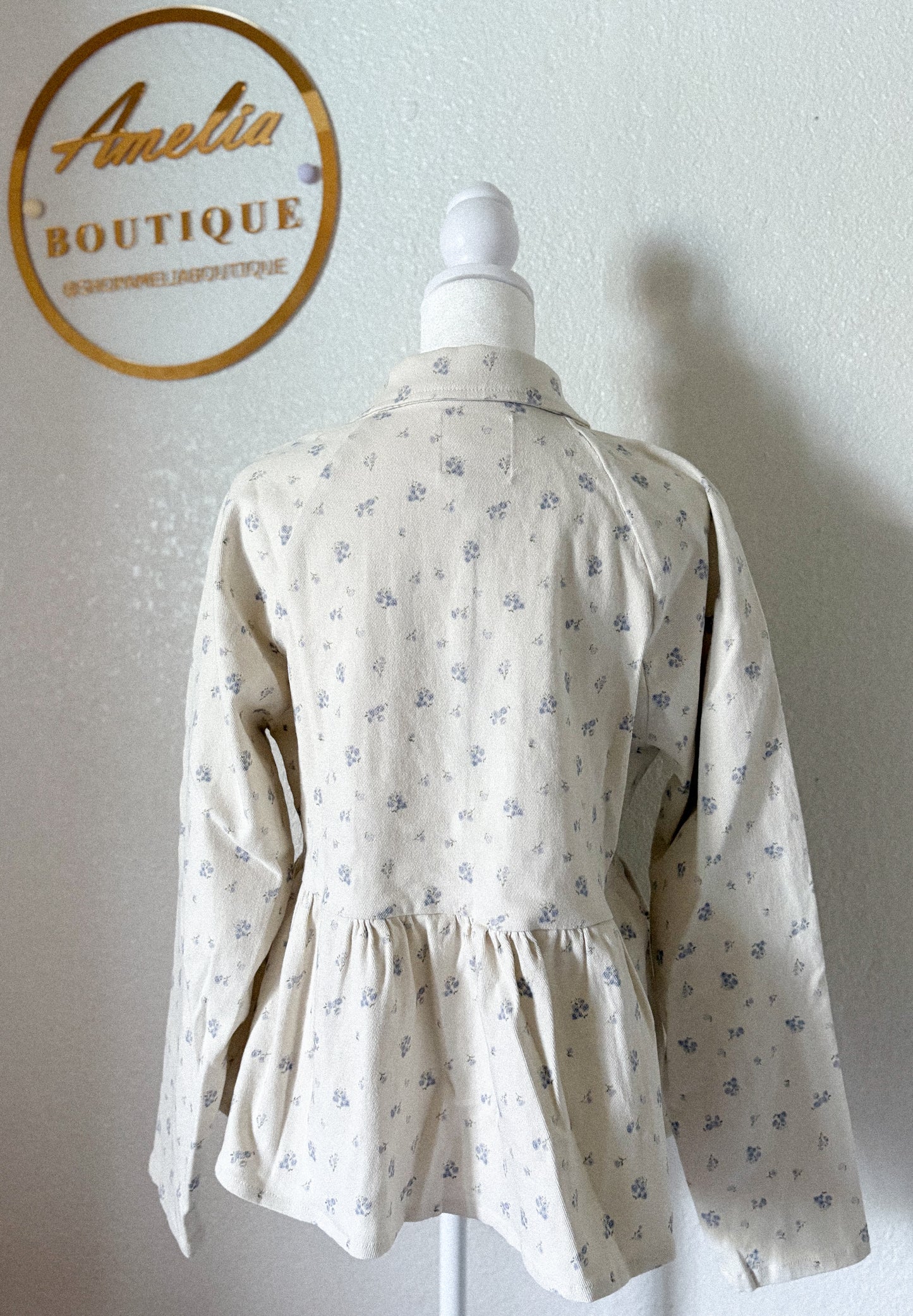 Jacket de sarga con estampado floral peplum