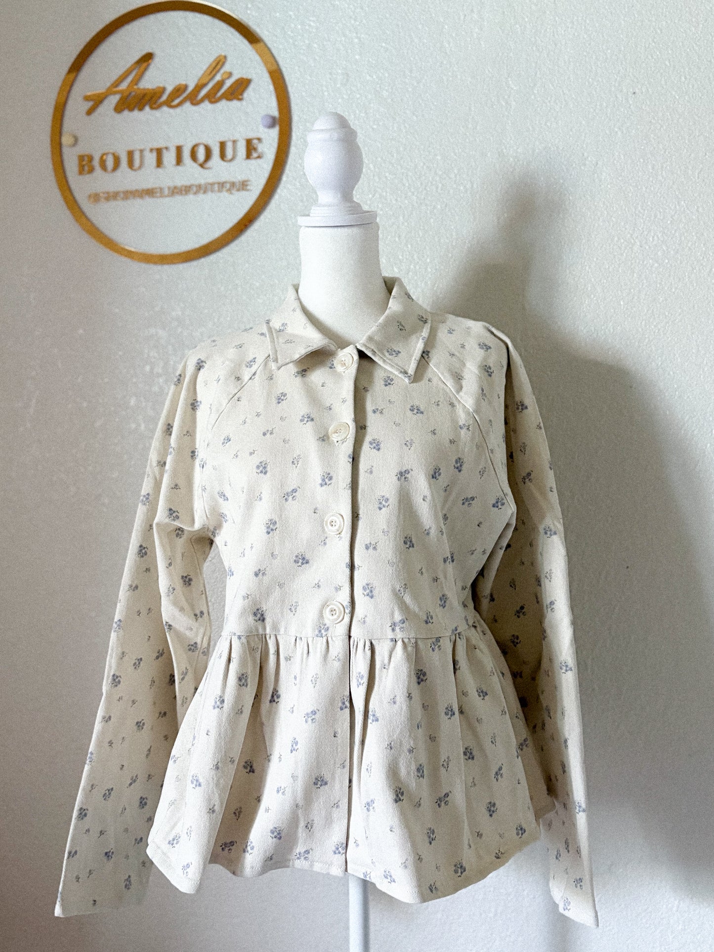 Jacket de sarga con estampado floral peplum