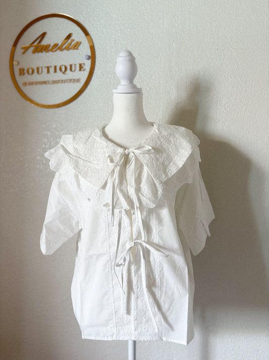 Blusa atemporal Coquette